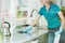 Woman wiping down kitchen countertop