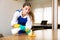 Woman wiping dust from desk