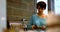 Woman wiping a plate in kitchen