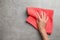 Woman wiping stone surface with kitchen towel, top view.