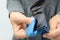 Woman wiping sunglasses with microfiber cleaning cloth