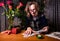 Woman witch guesses on the cards. She carefully examines the cards laid out on the table