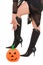 woman witch legs in halloween pumpkin