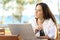 Woman wondering working on a beach apartment