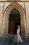 Woman wooden door Gothic Church