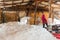 Woman worker dips and throwing rock salt