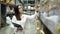 Woman worker holding clipboard and checking inventory in the warehouse store