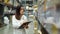 Woman worker holding clipboard and checking inventory in the warehouse store