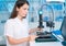 Woman worker in laboratory of electronics devices