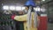 Woman worker in mask controls the recycle waste separation of recyclable waste plants. Sorting glass bottles into boxes