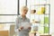 Woman worker with short dyed blonde hair holds clipboard