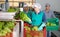 Woman worker sorting lettuce in vegetable factory