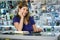 Woman Working As Computer Shop Owner Checking Bills And Invoices