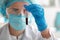 Woman working with blood sample in laboratory, closeup