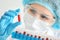 Woman working with blood samples in test tubes, closeup