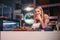 Woman is working with cakes at bakery shop