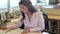 Woman Working At Desk In Architects Office