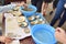 Woman working on extracting pearls from oyster shells. Vietnamese factory near Ha Long Bay