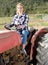 Woman working on garden plow