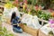 Woman working in greenhouse