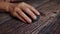 A woman working on the Internet, close-up hand uses a wireless mouse device to navigate the Internet.