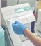 Woman working in a laboratory on a modern machine for blood testing. Doctor checks the blood of the patients.