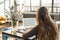 Woman Working on a Laptop female back, focus on laptop