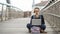 woman working on laptop while sitting on the street. The concept of working Freelancer or Blogger.