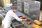 Woman working in a large bakery - industrial production of bakery products on an assembly line