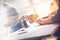 Woman working with mobile phone in office. Paperwork on the table, open space