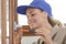 Woman working on new door kitchen installation