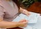 Woman working on paperwork on table