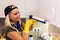 Woman working with silicone glue. Caulking the kitchen