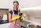 Woman working with silicone glue. Caulking the kitchen