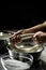 Woman working in a small family creamery is processing the final steps of making a cheese, produces handmade mozzarella, silano or