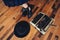 Woman working with typewriter on wooden floor. Top view