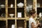 Woman working at vintage ceramics shop