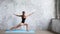 Woman workout indoors, doing yoga exercise on blue mat.