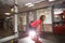 Woman works out on a gym machine in the gym. Training in the club for weight loss, strengthening the muscles. Sportswear, training