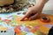 Woman with world map at table. Travel during summer vacation