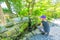 Woman worshiping Jizo Statue