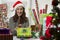 Woman wrapping Christmas presents.