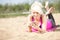 Woman writes short message on the beach