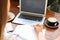 Woman writing blog content in notebook at table