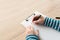 Woman writing on clipboard note pad paper