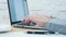 Woman writing on computer keyboard