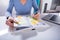 Woman Writing Schedule In Calendar Diary On White Desk