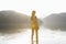 Woman In Yellow Bikini Standing In Lake