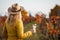 Woman with yellow coat and hat enjoying white wine in her vineyard  at autumn