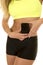 Woman yellow sports bra electronic measure abs close